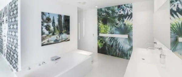 Elegant and modern designer bathroom in white with green nature accents